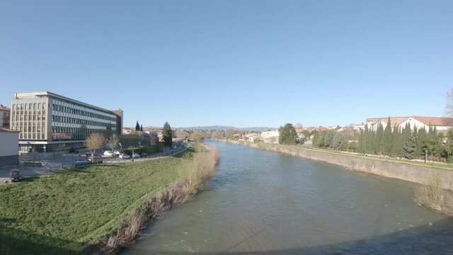 Carcassonne / Languedoc-Roussillon / France - March 15, 2020: The Aude River and the CPAM de l'Aude (the local Health Insurance Funds (Caisses Primaires d'Assurance Maladie/ CPAM) building