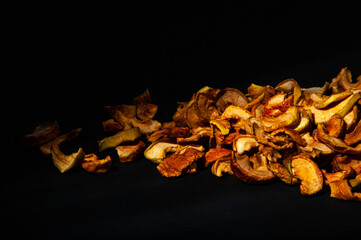 Dried fruit slices, on a dark background