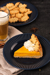 Pumpkin spicy latte with autumn cookies and sweet pie.