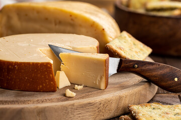 Gouda Cheese on a Cutting Board