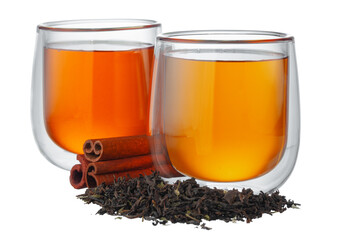 Glass cup of tea with dry tea leaves isolated on white