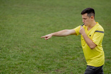 Referee showing on penalty while gaming. Concept of sport, rules violation, controversial issues, obstacles overcoming.