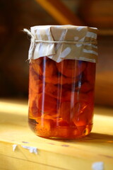 Jar of jam on a wooden shelf