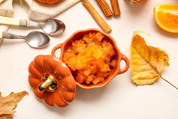 Pot of tasty pumpkin jam on table