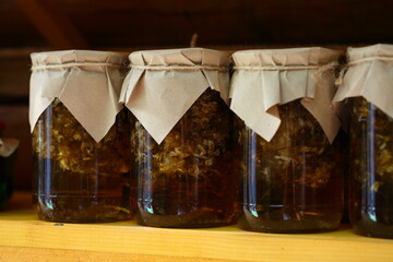 Jar of jam on a wooden shelf