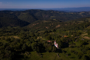 Aerial drone photograph with Lindenfeld deserted village in Semenic Mountains, Romania. The last...