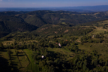 Obraz premium Aerial drone photograph with Lindenfeld deserted village in Semenic Mountains, Romania. The last inhabitant of the village, Paul Schwirzenbeck, died in 1998.
