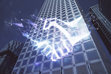 Double exposure of handshake hologram over city view background. Concept of partnership.