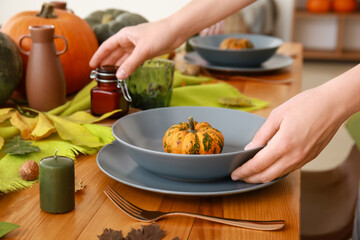 Woman serving table at home