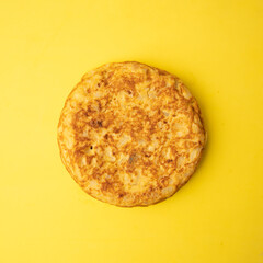 omelette with potatoes on yellow background