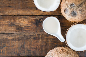 coconut milk and coconut on wood