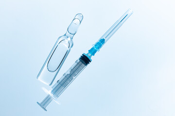 Medical vial with medication and syringe close up