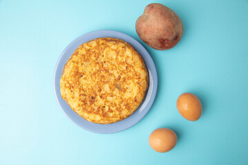 omelette with potatoes on blue background