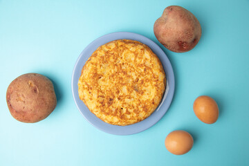 omelette with potatoes on blue background