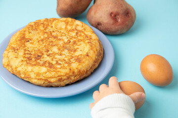 omelette with potatoes on blue background