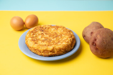 omelette with potatoes on yellow background