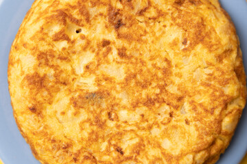 omelette with potatoes on yellow background