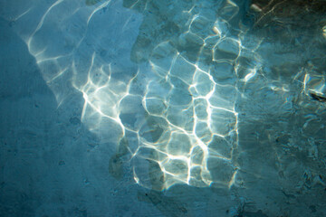 French blue pool reflecting sunlight