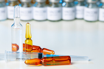 Medical vial with medication and syringe close up