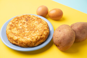 omelette with potatoes on yellow background