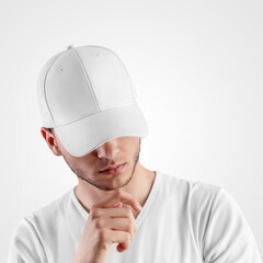 Mockup of a white baseball cap on a guy with his head down, front view, for presentation of design, pattern.