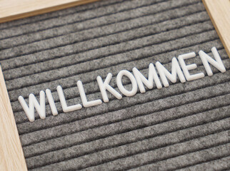 Welcome - Willkommen word out of white letters