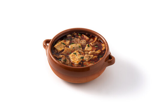 Traditional mondongo or el menudo soup isolated on white background