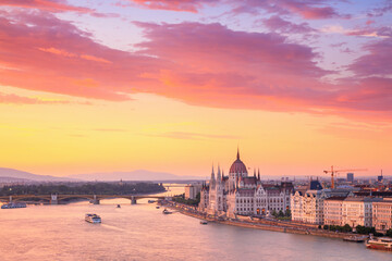 Fototapeta na wymiar City summer sunset landscape - top view of the Hungarian Parliament Building and Danube river with Margaret Bridge in the historical center of Budapest, in Hungary