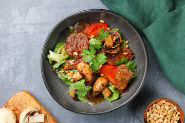 beef salad with mushrooms, pine nuts and tomatoes. salad with ingredients top view