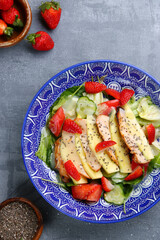 salad with chicken and mango. salad and ingredients on concrete table top view
