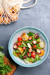 potatoes and octopus salad with ingredients on table top view