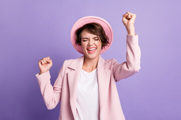 Obraz na płótnie Canvas Photo of curly lucky woman girl wear pink vintage jacket closed eyes open mouth arms fists isolated violet color background