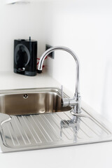 Kitchen faucet with a metal sink