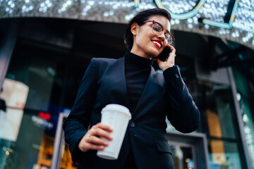 Woman talking on phone in street