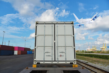 Obraz premium Container load on train, Railway cargo Train Transport cargo container under a plane in port on harbor background.