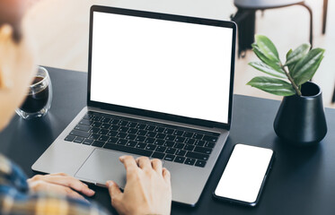 computer,cell phone mockup.hand woman work using laptop texting mobile.blank screen with white background for advertising,contact business search information on desk in cafe.marketing,design