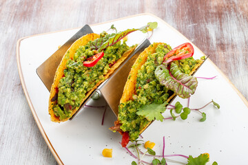 Mexican tacos. With pork, pepper and guacomole. Mexican traditional dish