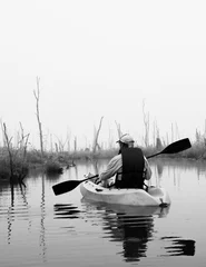 Foto op Canvas Lone kayaker on the foggy marsh in black and white © DanaDaglePhotography