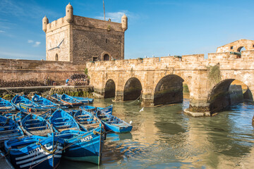Traditional blue fishing boats in the old port of Essaouira, Morocco