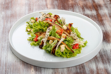Salad with baked eggplant, mozzarella and romaine lettuce