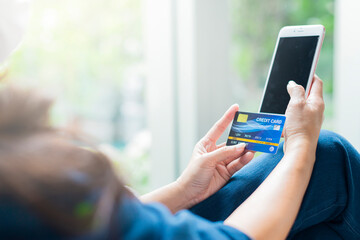.Business and Modern lifestyle concept - Woman using app on a smart phone while relaxing in cafe during free time with copy space. Selective focus.