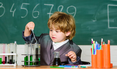 result. Medical concept. Little genius child. testing tubes with liquid for research. small boy study chemistry. learn for future. Biology science. small boy - Confident medical expert