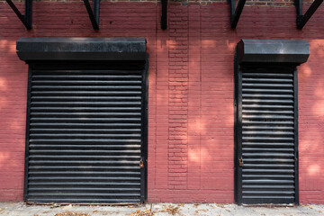 Two Industrial Overhead Rolling Doors on a Red Brick Building in Brooklyn New York