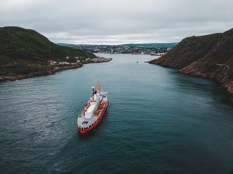 Coast guard boat entering the harbour in st. johns newfoundland canada on an overcast day