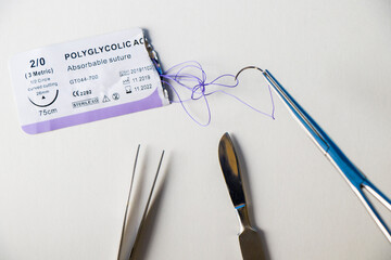 Surgery operation equipment, scalpel, knife, needle and suture. Studio shoot.