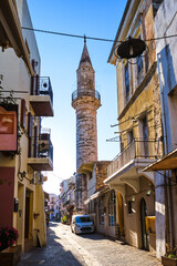 Fototapeta na wymiar Beautiful view of narrow streets of old town of Chania, Crete, Greece in early morning. Historic monument of Ottoman era Ahmet-aga minaret.