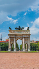 Fototapeta na wymiar Triumphal Arch called Arch of Peace (Porta Sempione) in Milan historical downtown, Sempione Park, Italy