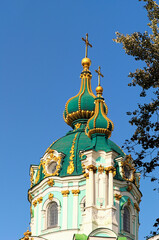 Close up view the top of charming ancient Saint Andrew Church. It is a major Baroque church. It was constructed between 1747 and 1754, to a design by the Italian architect Bartolomeo Rastrelli