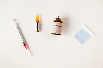 Vaccine ampule and needle