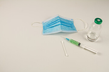 blue gloves medical swab for examination of covid 19 syringe and vaccine test